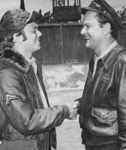 Robert Crane Jr. shaking his dad's hand on the set of Hogan's Heroes.